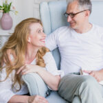happy senior couple smiling indoors
