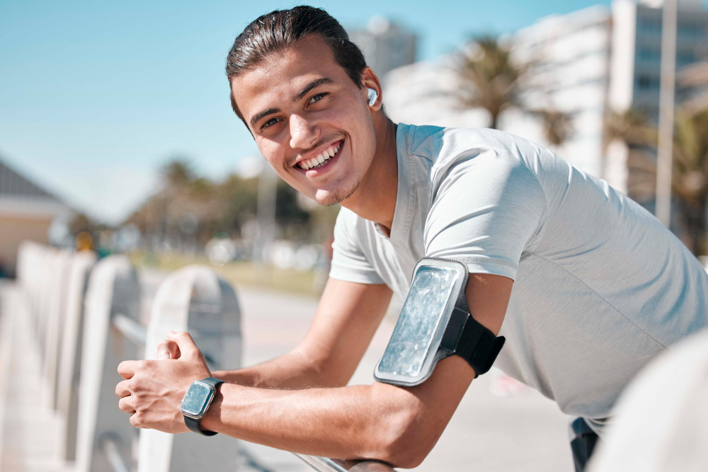 Smiling man stretching outdoors representing improved strength and vitality after low testosterone treatment in Voorhees Township NJ