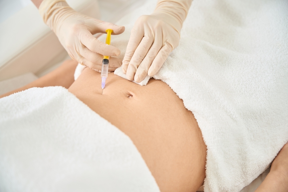 Healthcare provider administering a subcutaneous injection at a peptide therapy clinic serving Cherry Hill NJ
