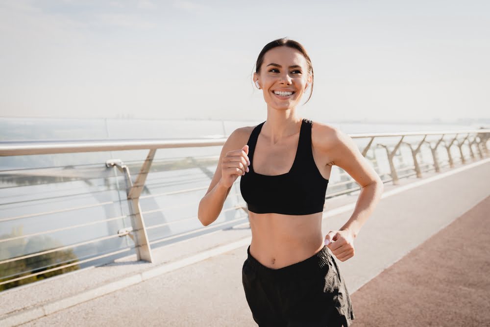 Woman running outdoors with renewed energy and vitality from BHRT serving Haddonfield NJ